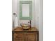 Stylish powder room with a decorative bowl sink, and wood vanity at 218 South Se Ave, Atlanta, GA 30315