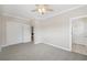Spacious bedroom features a ceiling fan, and two doors, with a large closet space at 218 South Se Ave, Atlanta, GA 30315