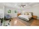 Spacious primary bedroom boasts hardwood floors, large windows, and a beautiful coffered ceiling at 218 South Se Ave, Atlanta, GA 30315
