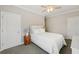 Cozy bedroom featuring carpet flooring, a ceiling fan, and a comfortable bed at 218 South Se Ave, Atlanta, GA 30315