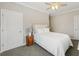 Neutral bedroom features a ceiling fan and two doors, with a hardwood nightstand at 218 South Se Ave, Atlanta, GA 30315