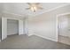 Bedroom with neutral paint and trim, ceiling fan, double closets and attached bath at 218 South Se Ave, Atlanta, GA 30315