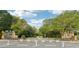 Community entrance featuring stone pillars, manicured landscaping, and a welcoming atmosphere at 218 South Se Ave, Atlanta, GA 30315