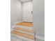 Entryway features light wood stairs, white trim and a white exterior door at 218 South Se Ave, Atlanta, GA 30315