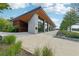 Modern building featuring a combination of wood and stone with large windows, offering an elegant design at 218 South Se Ave, Atlanta, GA 30315