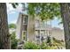 Back exterior view showcasing a two-story home with dual covered balconies at 218 South Se Ave, Atlanta, GA 30315