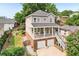 Charming home with a covered porch, two-car garage, well-manicured landscaping, and a inviting stairway entrance at 218 South Se Ave, Atlanta, GA 30315