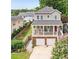 Charming two-story home featuring a welcoming front porch and a two-car garage in a neighborhood setting at 218 South Se Ave, Atlanta, GA 30315