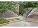 Exterior view of steps leading to the building entrance and retaining wall at 218 South Se Ave, Atlanta, GA 30315