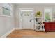 Inviting foyer featuring hardwood floors, white trim, and a decorative white front door at 218 South Se Ave, Atlanta, GA 30315