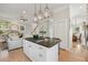 Open-concept kitchen with a large island, gas stovetop, granite countertops, and seamless flow to the living spaces at 218 South Se Ave, Atlanta, GA 30315