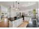 Well-lit kitchen with granite counters, stainless appliances, and a functional island at 218 South Se Ave, Atlanta, GA 30315