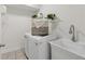Functional laundry room includes a sink and washer-dryer at 218 South Se Ave, Atlanta, GA 30315