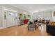 Open-concept living room and dining area featuring hardwood floors and a bright white front door at 218 South Se Ave, Atlanta, GA 30315