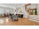 Spacious living room featuring hardwood floors, modern furniture, and a staircase with wooden banister at 218 South Se Ave, Atlanta, GA 30315