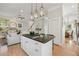 Open concept living room features hardwood floors, fireplace, and seamless flow into the kitchen at 218 South Se Ave, Atlanta, GA 30315