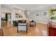 Bright living room with hardwood floors, stylish seating, and staircase, creating a welcoming atmosphere at 218 South Se Ave, Atlanta, GA 30315