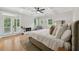 Bright primary bedroom boasts a fireplace, French doors, and natural light at 218 South Se Ave, Atlanta, GA 30315