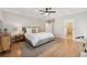 Comfortable main bedroom with hardwood floors, a neutral color palette, and an ensuite bathroom with a glass shower at 218 South Se Ave, Atlanta, GA 30315