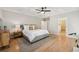 Large primary bedroom showcasing hardwood floors, coffered ceilings, and an en-suite bathroom at 218 South Se Ave, Atlanta, GA 30315