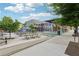 Outdoor seating area with picnic tables at the community area with modern buildings at 218 South Se Ave, Atlanta, GA 30315