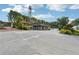 Street view of commercial buildings with a tower in the background and parking at 218 South Se Ave, Atlanta, GA 30315