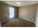 Standard bedroom featuring carpeted floors and a window for natural light at 3116 Leyland Ct, Decatur, GA 30034