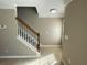 Foyer features a staircase with wooden railings, tiled floors, and neutral colored walls at 3116 Leyland Ct, Decatur, GA 30034
