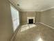 A cozy living room with tile flooring and a decorative fireplace with a white mantel at 3116 Leyland Ct, Decatur, GA 30034