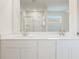 Modern bathroom with double sinks, granite countertops, and a glass-enclosed shower at 4036 Trimrose Ct, Atlanta, GA 30349