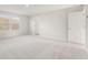 Spacious bedroom with neutral carpet, bright natural light, and a walk-in closet at 4036 Trimrose Ct, Atlanta, GA 30349