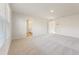 Bright, airy bedroom with neutral walls, plush carpet, and an ensuite bathroom at 4036 Trimrose Ct, Atlanta, GA 30349