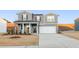 Charming two-story home featuring gray siding, a well-manicured lawn, and a spacious driveway at 4036 Trimrose Ct, Atlanta, GA 30349