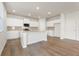 Modern kitchen featuring an island, granite countertops, white cabinets, and stainless steel appliances at 4036 Trimrose Ct, Atlanta, GA 30349