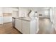 Open floor plan with a kitchen island featuring granite countertops and stainless steel dishwasher at 4036 Trimrose Ct, Atlanta, GA 30349