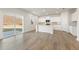 Open-concept kitchen featuring white cabinets, an island, and a sliding glass door at 4036 Trimrose Ct, Atlanta, GA 30349