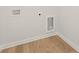 Dedicated laundry room features wood-look flooring and modern hookups for washer and dryer at 4036 Trimrose Ct, Atlanta, GA 30349