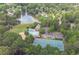 Aerial view showcases community amenities including a pool, tennis courts, and lake at 4246 N Mountain Ne Rd, Marietta, GA 30066