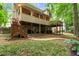 Inviting backyard has a covered patio, wooden deck, and mature landscaping at 4246 N Mountain Ne Rd, Marietta, GA 30066