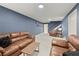 Spacious basement living area with comfortable seating and stairs to upper level at 4246 N Mountain Ne Rd, Marietta, GA 30066
