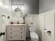 Tastefully decorated powder room with wainscoting, modern fixtures, and neutral colors at 4246 N Mountain Ne Rd, Marietta, GA 30066