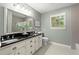 Bathroom with double vanity, granite countertops, subway tiled shower, and natural light at 4246 N Mountain Ne Rd, Marietta, GA 30066
