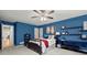 Bedroom featuring blue walls, carpet flooring and a ceiling fan at 4246 N Mountain Ne Rd, Marietta, GA 30066