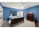 Blue bedroom featuring an accent wall with decorations and an attached ensuite at 4246 N Mountain Ne Rd, Marietta, GA 30066