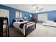 Bedroom featuring blue walls, carpet flooring and a ceiling fan at 4246 N Mountain Ne Rd, Marietta, GA 30066