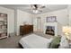 Bedroom featuring a decorative fireplace with storage and neutral carpeting at 4246 N Mountain Ne Rd, Marietta, GA 30066