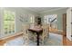 Bright dining room featuring neutral walls, plantation shutters, and classic furnishings at 4246 N Mountain Ne Rd, Marietta, GA 30066