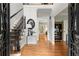 Inviting foyer with gleaming hardwood floors and a staircase with iron banisters at 4246 N Mountain Ne Rd, Marietta, GA 30066