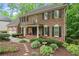 Beautiful brick home with lush landscaping and a welcoming front entrance at 4246 N Mountain Ne Rd, Marietta, GA 30066