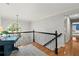 View of the upstairs hallway with an oval window and wrought iron railing at 4246 N Mountain Ne Rd, Marietta, GA 30066